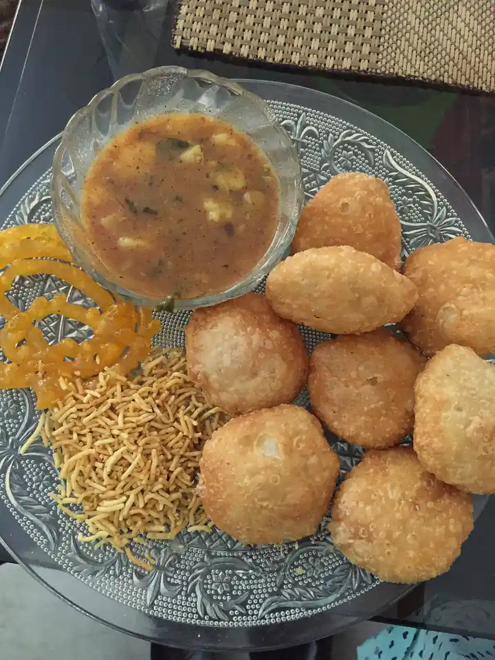 Kachoris with spicy potato sabzi, jalebi and sev