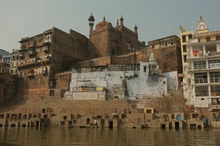 Stone steps and shrines of Panchganga Ghat rising from the river
