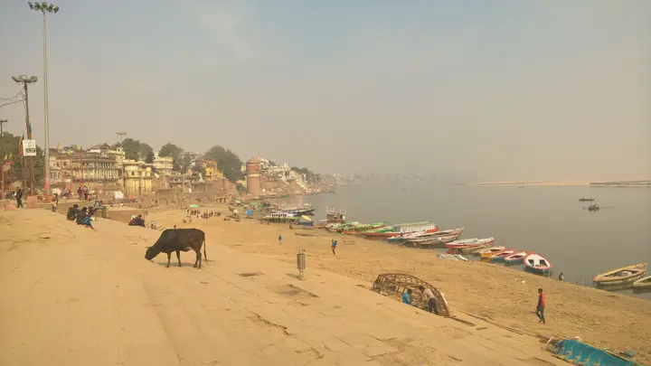 Paved riverfront at Assi Ghat with a row of historic ghats along the Ganga, Varanasi