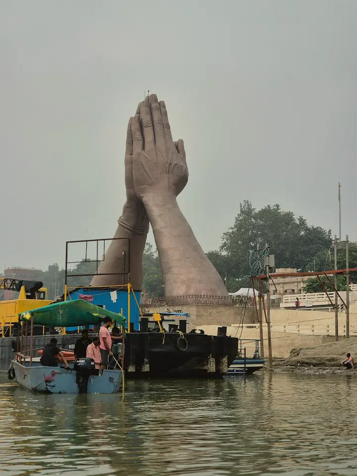 The giant folded-hands sculptures at Namo Ghat